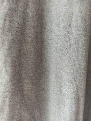 abstract background of gray fabric with wrinkled texture, close up