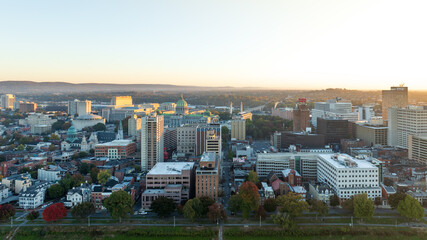 Aerial view of downtown Harrisburg, Pennsylvania, at sunrise, showcasing the city’s historic buildings and streets.