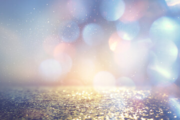 background of abstract glitter lights. blue, gold and purple. de focused