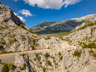 Rocky Mountain range with mountain road in the Adriatic Coast, Dalmatia, Croatia 