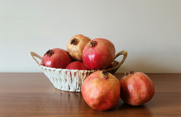 Pomegranates (Punica granatum) in a basket