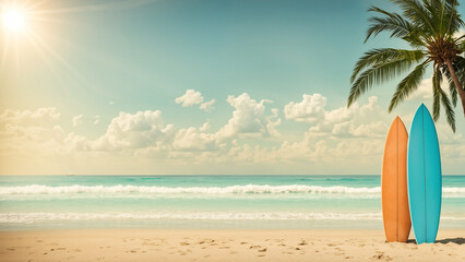 Two colorful surfboards stand on the sandy beach under a clear blue sky at sunrise. Summer background