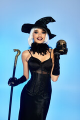 Dressed in a stunning witch costume, a young woman exudes Halloween flair and charm.