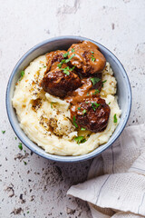 Beef meatballs in creamy sauce with mashed potatoes.