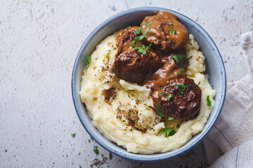 Beef meatballs in creamy sauce with mashed potatoes.