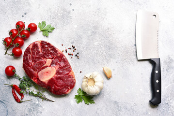 Fresh raw organic beef steak osso buko with ingredients for making. Top view with copy space.