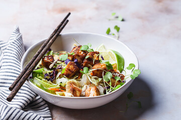 Crispy tofu salad with cashews and sprouts.