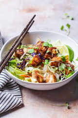 Crispy tofu salad with cashews and sprouts.