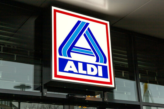 Aldi logo illuminated at the shop, Aldi supermarket groceries store, a global supermarket chains. Dordrecht, the Netherlands. 17 December 2023. 