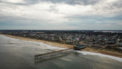 Aerial view of coastal town and pier