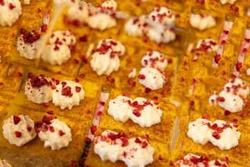 A beautifully decorated wedding table featuring a variety of delicious, vibrant, and elegantly presented sweet foods, creating a luxurious dining experience