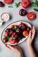 High-resolution image of fresh, juicy red tomatoes with water droplets on a clean background. This photo is perfect for promoting organic produce, healthy food, or farm-to-table concepts. 