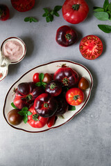 High-resolution image of fresh, juicy red tomatoes with water droplets on a clean background. This photo is perfect for promoting organic produce, healthy food, or farm-to-table concepts. 