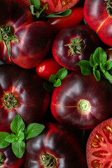 High-resolution image of fresh, juicy red tomatoes with water droplets on a clean background. This photo is perfect for promoting organic produce, healthy food, or farm-to-table concepts. 