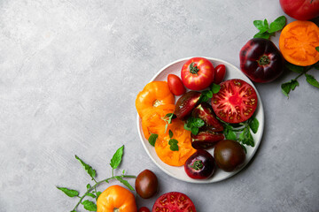 High-resolution image of fresh, juicy red tomatoes with water droplets on a clean background. This photo is perfect for promoting organic produce, healthy food, or farm-to-table concepts. 