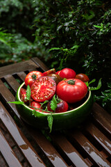 High-resolution image of fresh, juicy red tomatoes with water droplets on a clean background. This photo is perfect for promoting organic produce, healthy food, or farm-to-table concepts. 
