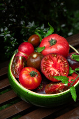 High-resolution image of fresh, juicy red tomatoes with water droplets on a clean background. This photo is perfect for promoting organic produce, healthy food, or farm-to-table concepts. 