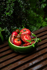 High-resolution image of fresh, juicy red tomatoes with water droplets on a clean background. This photo is perfect for promoting organic produce, healthy food, or farm-to-table concepts. 