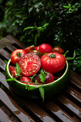 High-resolution image of fresh, juicy red tomatoes with water droplets on a clean background. This photo is perfect for promoting organic produce, healthy food, or farm-to-table concepts. 