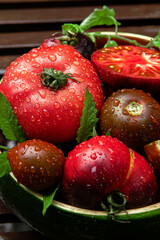 High-resolution image of fresh, juicy red tomatoes with water droplets on a clean background. This photo is perfect for promoting organic produce, healthy food, or farm-to-table concepts. 