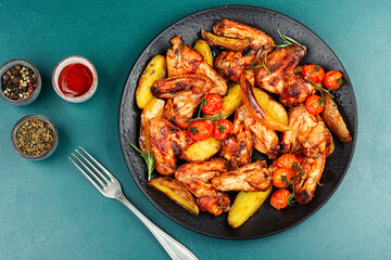 Barbecue chicken wings with sage.