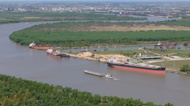 A drone flight showcases Piapsa port with ships in Z&aacute;rate, and the city of Campana in the background, in Buenos Aires province, Argentina.