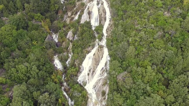 Aerial view down to up footage of waterfalls Ulassai Sardinia