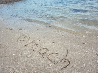 Hearts drawn on sand beach