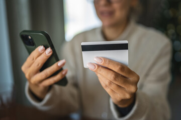 Adult woman use smart phone for online shopping transaction safely