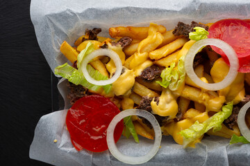 Overhead view of french fries with cheese