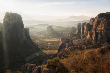Greece, Meteora - incredible sandstone rock formations. The Holly Monastery of Rousanou and St. Nikolaos Anapafsas Monastery on sunset