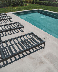 pool deck with chairs