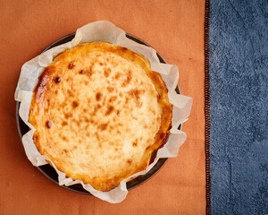 Cheesecake dessert for Thanksgiving. Copy space, flat lay. Basque dessert. Homemade baking. Fall recipe vibes .