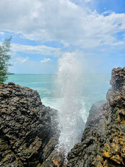 waves crashing on rocks