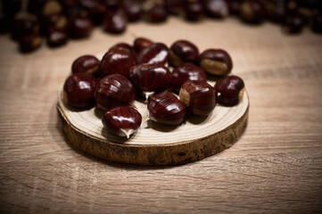 Chestnuts freshly picked in autumn in Candelario, presented on wood, still life