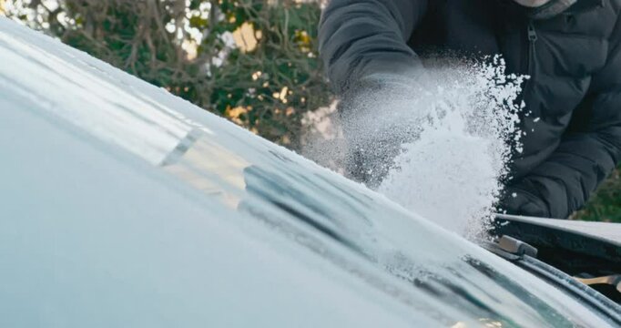 Winter Driving - Scraping the ice off a frozen windshield - Slow-mo