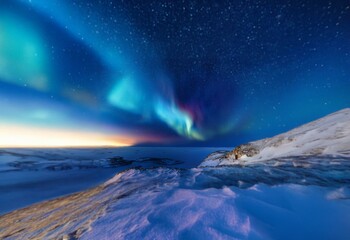 A vibrant aurora borealis dances across the night sky, casting a colorful glow on the snow-covered landscape below.