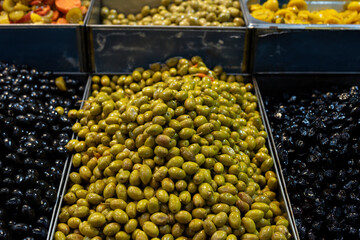 Green olives for sale at Machane Yehuda outdoor food market in Jerusalem.
