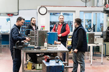 Males Industrial Engineers in Discuss New Project or planning investment project working and strategy. business making conversation at Industrial injection molding factory concept.