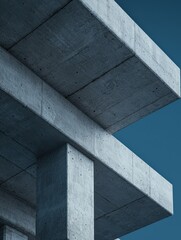 Fototapeta premium Abstract view of concrete architecture showcasing modern design elements against a clear blue sky.