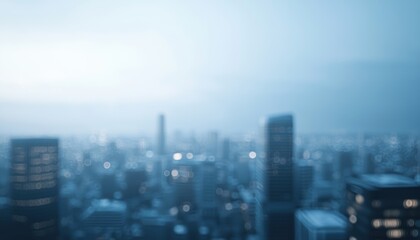 Blurred city skyline at dusk with a moody atmosphere and soft blue tones.
