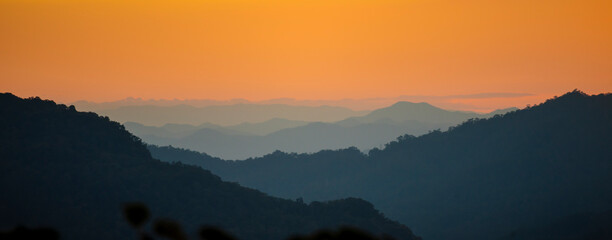 Banner Scenic view dramatic beautiful sunset sky. Panorama Natural Sunset Sunrise on meadow silhouette shadow dark land. Vibrant dramatic sky in Countryside. Landscape Sky At Sunset with copy space