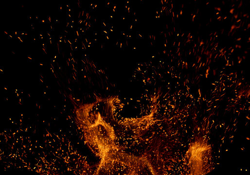 The image is of a fire with a lot of smoke and sparks