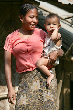 South asian tribal mother is smiling with her son