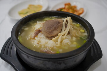 traditional Korean soup made by boiling beef head meat, ox bones, burdock, taro stems, and radish for a long time