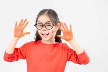 Little girl with hands painted in colorful paint.