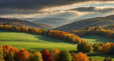 Obraz premium Beautiful autumn landscape with hay bales on a green field, colorful trees, and misty mountains in the background.