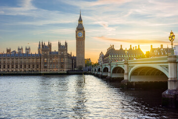 Fototapeta premium Houses of Parliament with Big Ben tower and Westminster bridge at sunset, London, UK