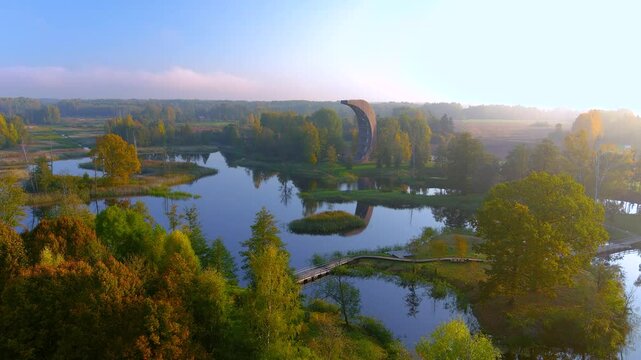 Amazing aerial view of Kirkilai karst lakes and lookout tower in the bright sunny autumn morning, Birzai eldership, Panevezys county, Lithuania