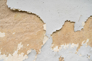 Close-up view of the wall paint peeling off.